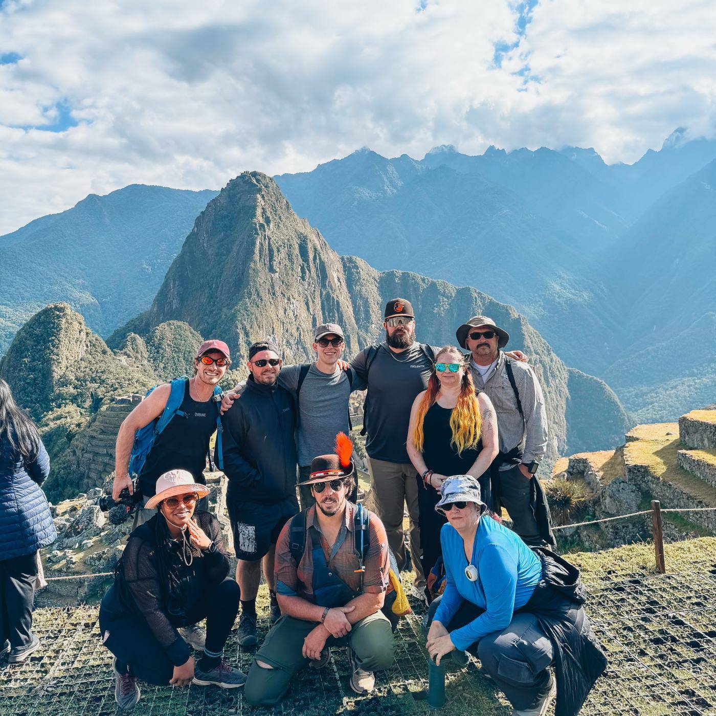 A travel group gathered at the Machu Picchu overlook