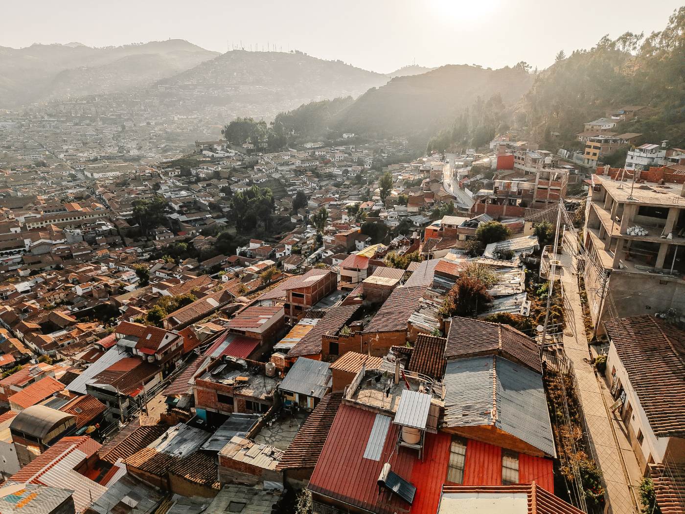Cusco rooftops climbing the hillsides in hazy morning sun