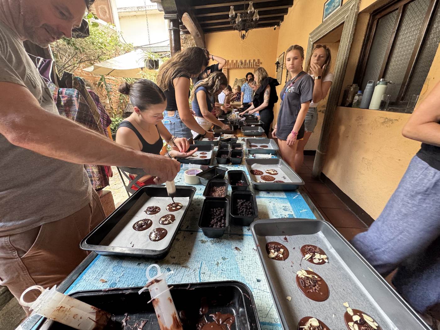 Students at a chocolate-making workshop in Antigua